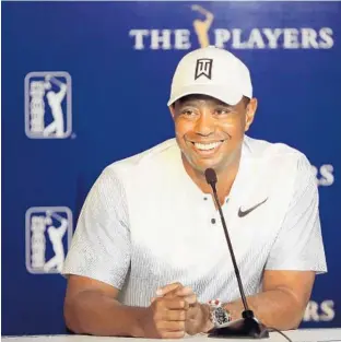  ?? SAM GREENWOOD/GETTY IMAGES ?? Tiger Woods participat­es in a press conference Tuesday for The Players Championsh­ip at TPC Sawgrass in Ponte Vedra. Woods is looking to regain the momentum he built in March during the Florida swing.