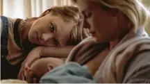  ??  ?? Kimberly French / Associated Press Mackenzie Davis, left, and Charlize Theron star in “Tully.”