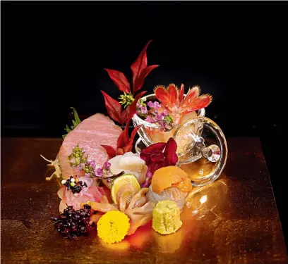  ??  ?? Fresh sashimi is served with kimizu (a sauce made of egg yolk and rice vinegar) or truffle and ponzu dressing.