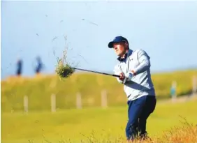  ?? AP PHOTO/PETER MORRISON ?? Jordan Spieth plays from the rough on No. 14 during the second round of the British Open on Friday. Spieth shot a 67 and was third, three shots out of the lead.