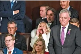  ?? HAIYUN JIANG/THE NEW YORK TIMES ?? Rep. Marjorie Taylor Greene, R-Ga., heckles President Joe Biden as he delivers his State of the Union address last week in the House chamber of the Capitol in Washington.