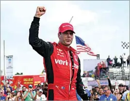  ?? PAUL SANCYA / AP ?? Will Power celebrates winning the IndyCar Detroit Grand Prix auto race on Belle Isle in Detroit on Sunday.