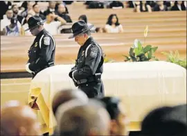  ?? Al Seib Los Angeles Times ?? MOURNERS at the services at Cathedral of Our Lady of the Angels included law enforcemen­t from across the state and the country with state and local officials.