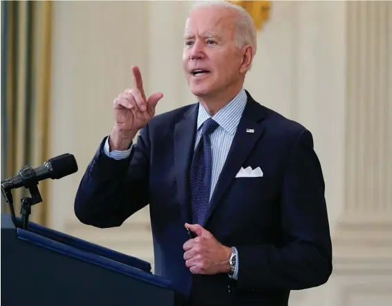  ??  ?? President Joe Biden takes questions from reporters as he speaks about the COVID-19 vaccinatio­n program, in the State Dining Room of the White House in Washington. Photo: Evan Vucci/AP