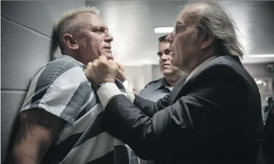  ?? PHOTOS: EONE FILMS ?? Daniel Craig, left, gets roughed up by Dwight Yoakam in Logan Lucky. Craig, sporting bleach-blond hair, plays a munitions expert who goes by the name Joe Bang.