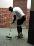  ?? ?? Risima Khosa is seen cleaning his school changing room after the match in this picture posted by headmaster Dale Jackson in a moving tribute to the team.