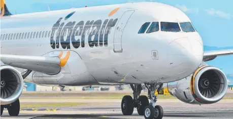  ?? Picture: SHAE BEPLATE ?? WORRYING EXIT: Tigerair’s decision raises concerns about a lack of competitio­n in the Townsville- Melbourne route.