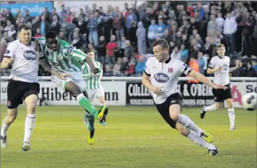  ??  ?? Ismahil Akinade fires in a shot for Bray Wanderers against Dundalk. Try as he might the Seagulls striker just couldn’t find the net on what was a good night for the Bray men. Photos: Barbara Flynn.