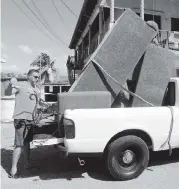  ??  ?? Eliecer Lugo packs his belongings after his house was damaged in Guanica.