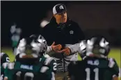  ?? JOSE CARLOS FAJARDO — BAY AREA NEWS GROUP ?? De La Salle head coach Justin Alumbaugh speaks to his players before the start of their game against St. Mary’s at De La Salle High School in Concord on March 13.