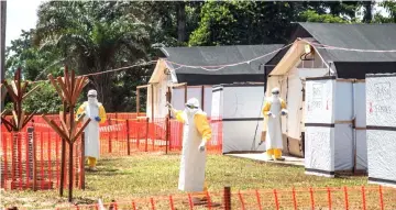  ??  ?? File photo shows health workers operating within an Ebola safety zone in the Health Centre in Iyonda, near Mbandaka. — AFP photo