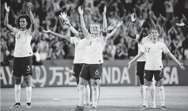  ?? Franck Fife / AFP/Getty Images ?? In the front row for France, defender Wendie Renard, from left, midfielder Amandine Henry and defender Sakina Karchaoui celebrate their win over Brazil that put them on a collision course with the U.S.