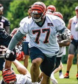  ?? NICK GRAHAM / STAFF ?? The Bengals saved $9.5 million against the salary cap Friday by releasing offensive tackle Cordy Glenn. NFL free agency starts at noon Wednesday.