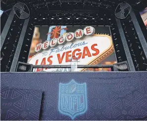  ?? STEVE LUCIANO/ AP ?? Players strolled across the stage Thursday night at the NFL Draft Theater in Las Vegas.