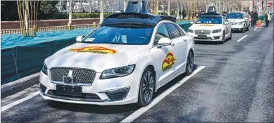  ?? ZHU XINGXIN / CHINA DAILY ?? Baidu’s Apollo driverless cars conduct road tests in Beijing.