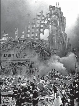  ?? SHAWN BALDWIN/AP 2001 ?? More than 7,500 first responders at the three 9/11 sites were diagnosed with cancer.