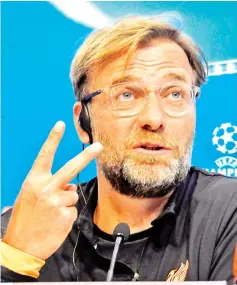  ?? — AFP photo ?? Liverpool’s German coach Jurgen Klopp gestures during a press conference at Ramon Sanchez Pizjuan stadium in Sevilla on November 20, 2017 on the eve of the UEFA Champions League group E football match between Sevilla and Liverpool.