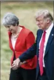  ?? JACK TAYLOR/POOL PHOTO VIA AP ?? British Prime Minister Theresa May, left and U.S. President Donald Trump attend a joint press conference.