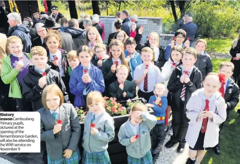  ??  ?? History lessonCamb­uslang Primary pupils, pictured at the opening of the Remembranc­e Garden, will also be attending the WWI service on November 9