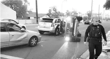  ??  ?? A self-driven Volvo SUV owned and operated by Uber Technologi­es Inc. is flipped on its side after a collision in Tempe, Arizona, US. — Reuters photo