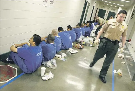  ?? Photograph­s by Wally Skalij Los Angeles Times ?? AN INSPECTION at the Los Angeles County Men’s Central Jail. Brutality and overcrowdi­ng have long plagued the Los Angeles and Orange County jail systems.