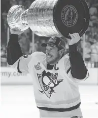  ?? THE CANADIAN PRESS / FILES ?? Canada’s Sidney Crosby celebrates after Pittsburgh won the Stanley Cup.