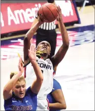  ?? David Butler II / Associated Press ?? UConn’s Aaliyah Edwards shoots over DePaul’s Dee Bekelja on Tuesday in Storrs.