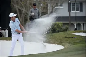  ?? PHELAN M. EBENHACK — THE ASSOCIATED PRESS ?? Harris English hits out of a bunker onto the 14th green during the final round of the Arnold Palmer Invitation­al golf tournament in Orlando, Fla on March 8, 2020.