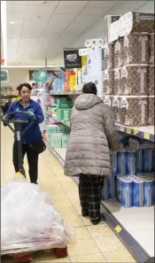  ??  ?? Shopping for toilet roll in Aldi on Friday.