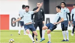  ??  ?? Buriram United players take part in a training session yesterday.