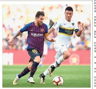  ??  ?? Out of my way: Barcelona forward Lionel Messi (left) vying for the ball with Boca Juniors defender Paolo Goltz during a friendly at the Nou Camp on Wednesday. — AFP