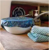  ??  ?? Beeswax food wraps and hand-knitted dish cloths (left) can replace plastic wrap and paper towels. Bring your own cutlery and takeout containers (right) ashore.
