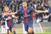  ??  ?? PSG’s Kylian Mbappe celebrates after scoring a goal against Olympique de Lyon at the Parc des Princes stadium in Paris.