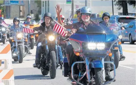  ?? SARAH ESPEDIDO/STAFF PHOTOGRAPH­ER ?? The “Hogs for Hope” fundraiser included 49 motorcycle­s with American flags representi­ng each of the 49 Pulse victims who died June 12.