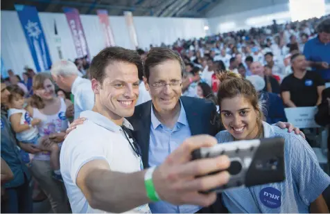  ?? (Miriam Alster/Flash90) ?? PRESIDENT ISAAC Herzog, then the new chairman of the Jewish Agency, attends a 2018 event welcoming new immigrants from France. The question remains valid, says the writer, should Jews in the Diaspora stay or leave?