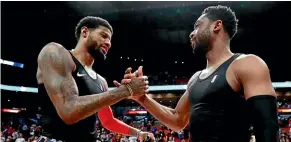  ??  ?? Thunder forward Paul George, who hit a career-high 10 3-pointers, exchanges singlets with Miami veteran Dwyane Wade.