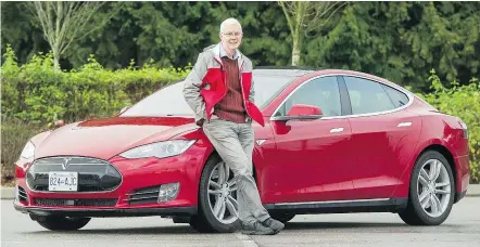  ?? ARLEN REDEKOP/PNG ?? Bruce Sharpe, vice-president of the Vancouver Electric Vehicle Associatio­n, poses with a Tesla in Surrey. He calls a Simon Fraser University report card on Canada’s electric vehicle policies ‘an excellent piece of work’ that’s ‘going to be really...