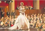  ??  ?? Jennifer Lawrence wears Dior to pick up her Best Actress award at the Oscars in 2013