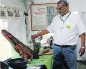  ?? ?? LEFT: Collin Dasappa, chairperso­n of the Illovo Reunion Committee, shows the items that were used by the community, some of which are more than 100 years old.