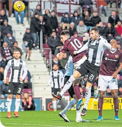  ??  ?? Hearts’ Jamie Walker scores to make it 4-2, putting the game out of reach for St Mirren