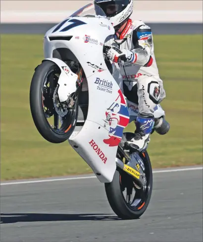  ?? Photo: Bonnie Lane ?? John McPhee does a wheelie after his impressive eighth-place finish in Valencia.