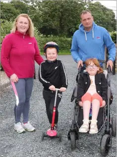  ??  ?? Mia-Lily and Lorcan Ruttle from Caim, heading out again, on their 100k Wheel Challenge for Enable Ireland, along with their parents Ailish and Trevor.