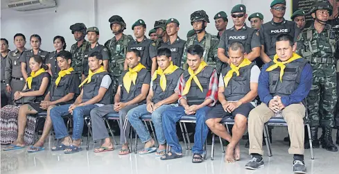  ?? PHOTO BY POLICE ?? Eight suspects in the massacre of eight family members, including three young children in Krabi, are to be questioned further by police who took custody of them from the military yesterday.