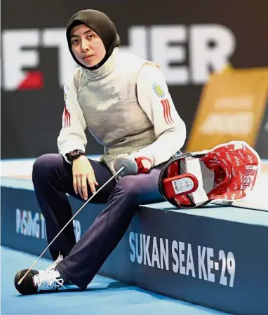  ??  ?? Taking a breather: Natasha Ezzra Abu Bakar posing for a photograph after her training session at Hall 6 of the Malaysian Internatio­nal Trade and Exhibition Centre in Kuala Lumpur yesterday.