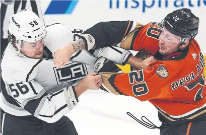  ?? ICON SPORTSWIRE GETTY IMAGES ?? Anaheim Ducks forward Nicolas Deslaurier­s, exchanging blows with Los Angeles Kings defenceman Kurtis MacDermid, was involved in 14 fights, double the total of any other player, when the National Hockey League season was put on hold.