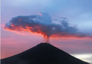  ?? Picture / AP ?? Bali’s Mt Agung volcano has spewed out a massive ash cloud leading experts to think it is on the brink of a major eruption.