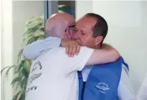  ?? (Marc Israel Sellem/The Jerusalem Post) ?? AVI BALASHNIKO­V is embraced by Jerusalem Mayor Nir Barkat at a ceremony on the first anniversar­y of the death of Balashniko­v’s wife, Revital Yahalomi-Balashniko­v.