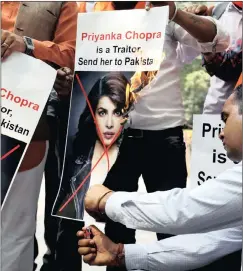  ?? PICTURE: SAUMYA KHANDELWAL/REUTERS ?? INFLAMED: Supporters of Hindu Sena, a right-wing Hindu group, burn posters of Bollywood actress Priyanka Chopra during a protest in New Delhi, India, on Saturday.