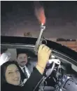  ?? Twitter ?? A screen grab of Iraqi member of parliament Wihda Al Jumaily firing a gun into the sky