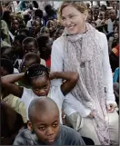  ??  ?? STAR-STRUCK: Madonna during a visit to a school in Malawi in 2013